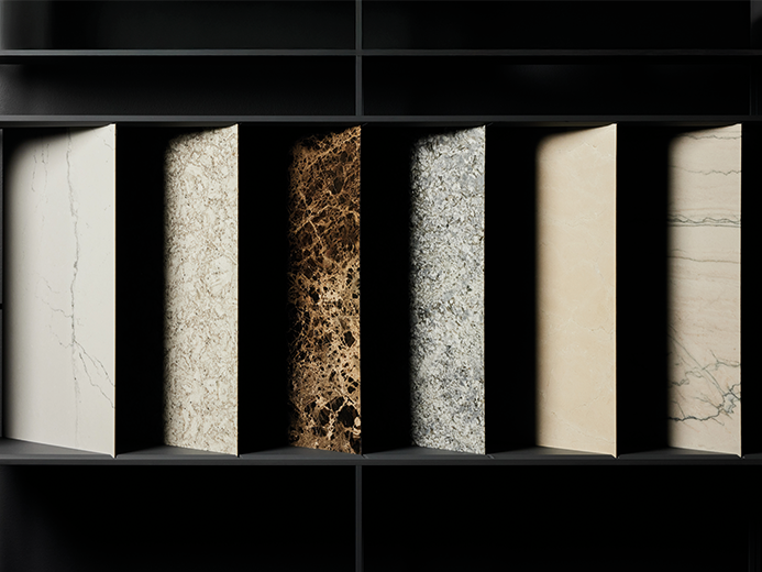 Plusieurs surfaces Dünnstein de F/LIST, dans différents aspects de pierre naturelle clairs et foncés, présentées sur un mur noir